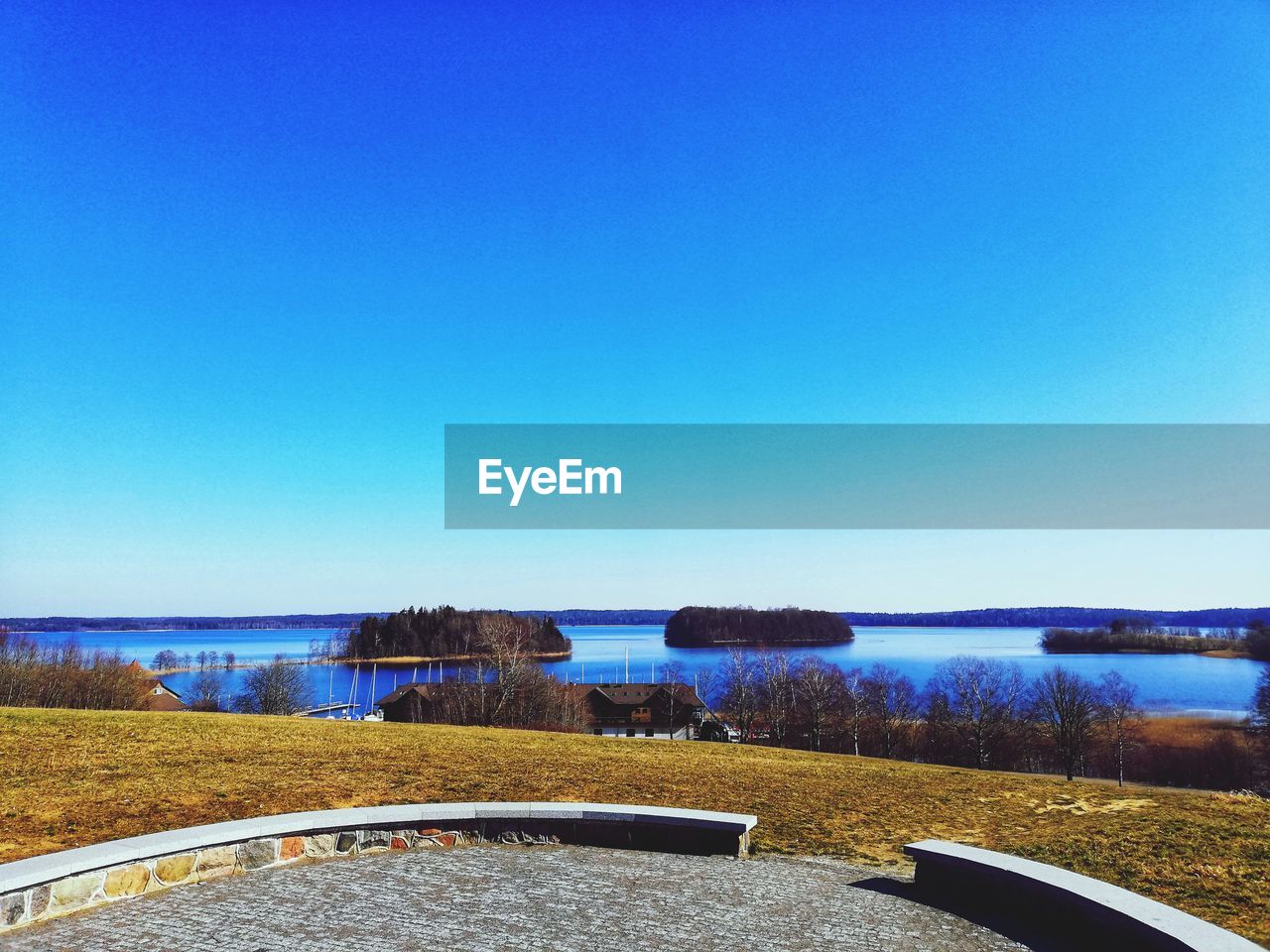 SCENIC VIEW OF LAKE AGAINST CLEAR SKY