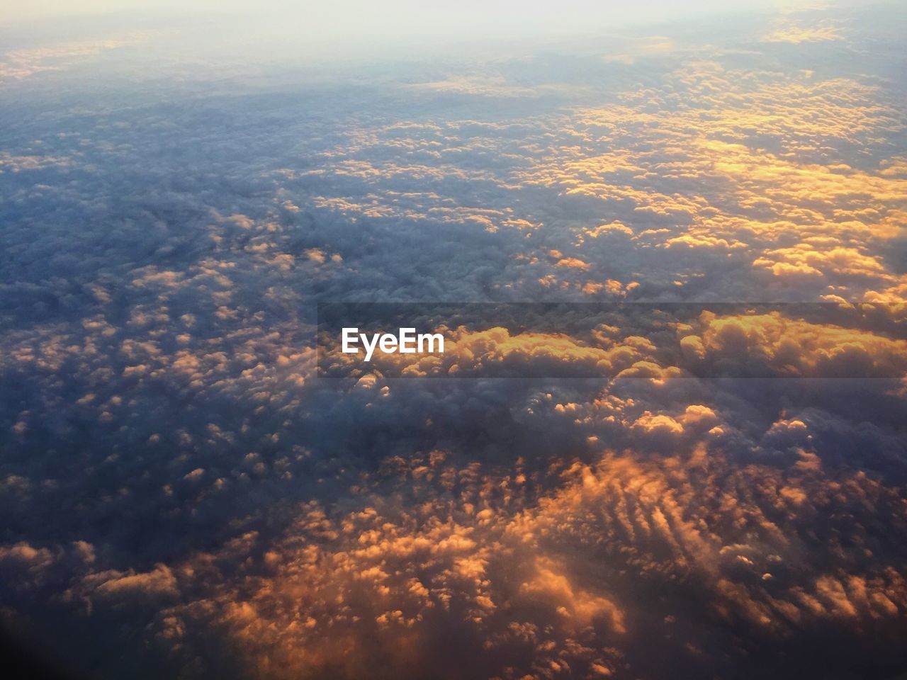 AERIAL VIEW OF CLOUDS OVER LANDSCAPE