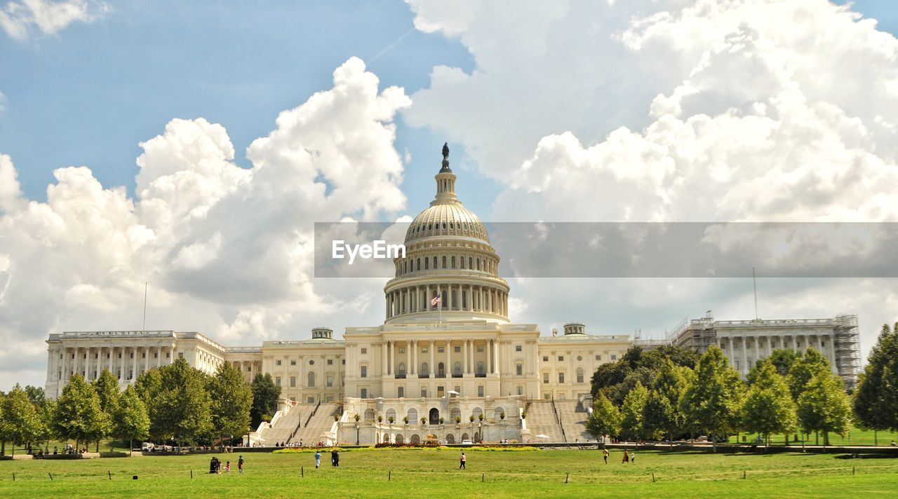 Panoramic view of historical united states capitol congress building against sky