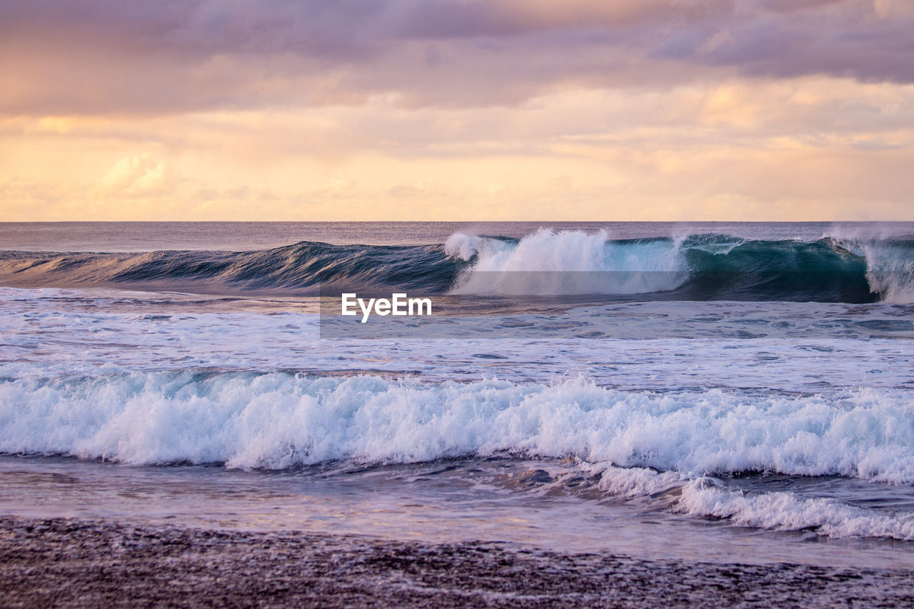 Waves in the atlantic ocean, before sunset, colorful sky, azores travel destination.