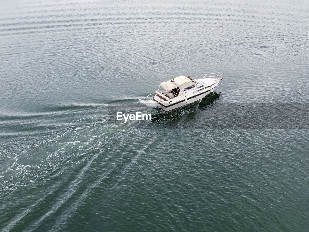 water, nautical vessel, transportation, mode of transportation, high angle view, sea, vehicle, day, waterfront, boat, nature, ship, no people, watercraft, travel, wave pattern, outdoors, beauty in nature, sailing, motion, wake, tranquility