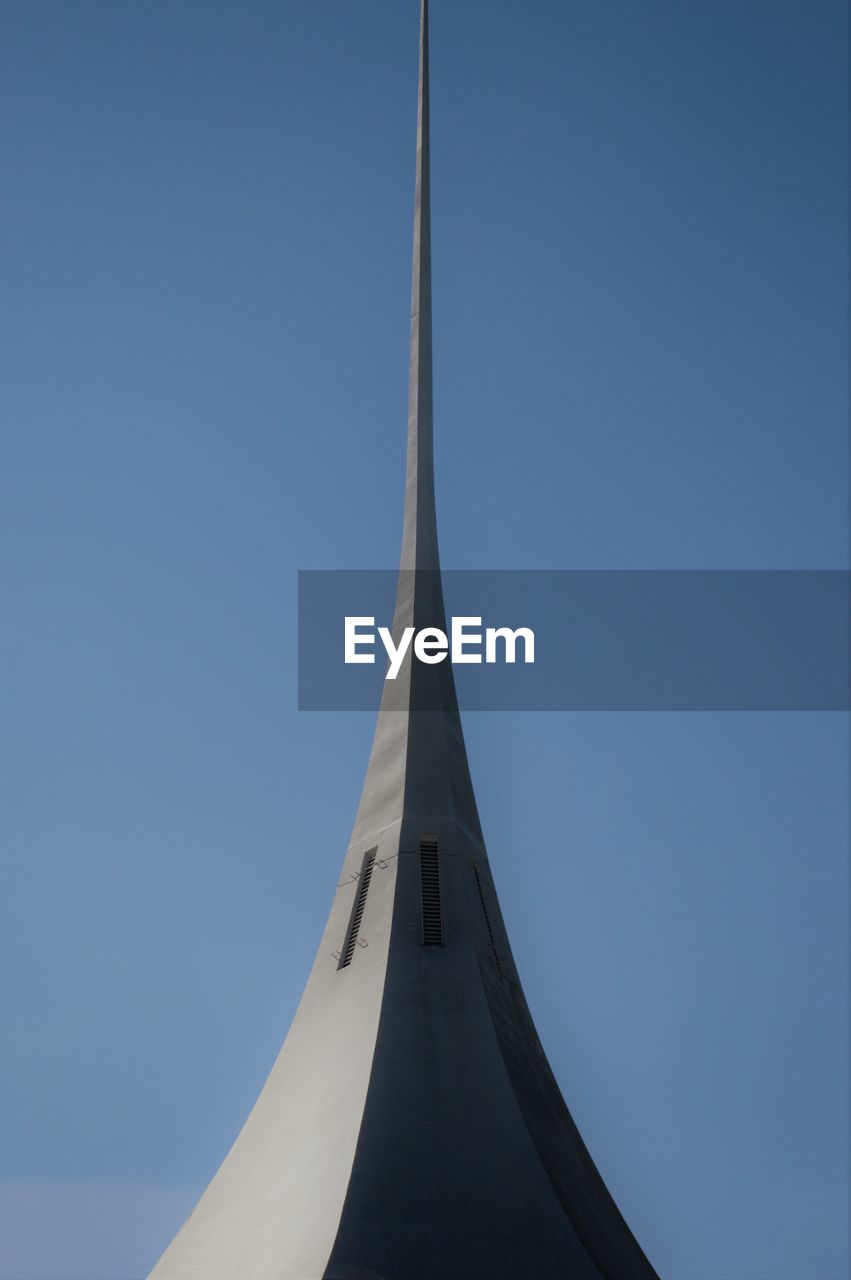 HIGH SECTION OF BUILDING AGAINST BLUE SKY