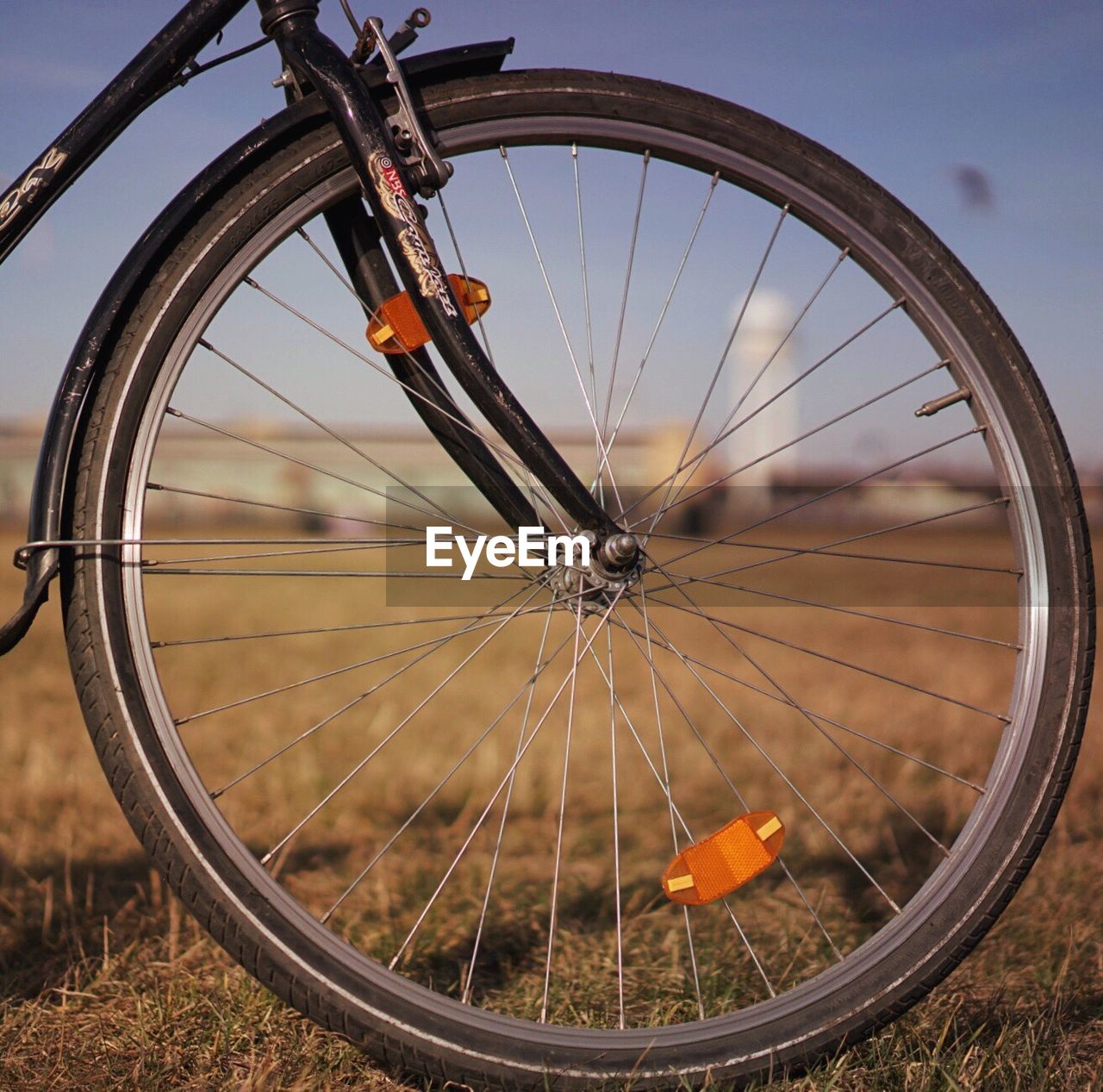 LOW ANGLE VIEW OF WHEEL AGAINST SKY