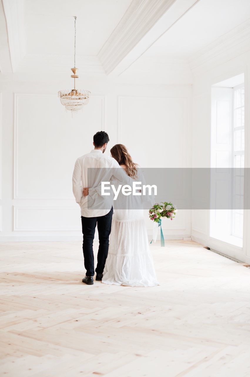 Young couple standing at home