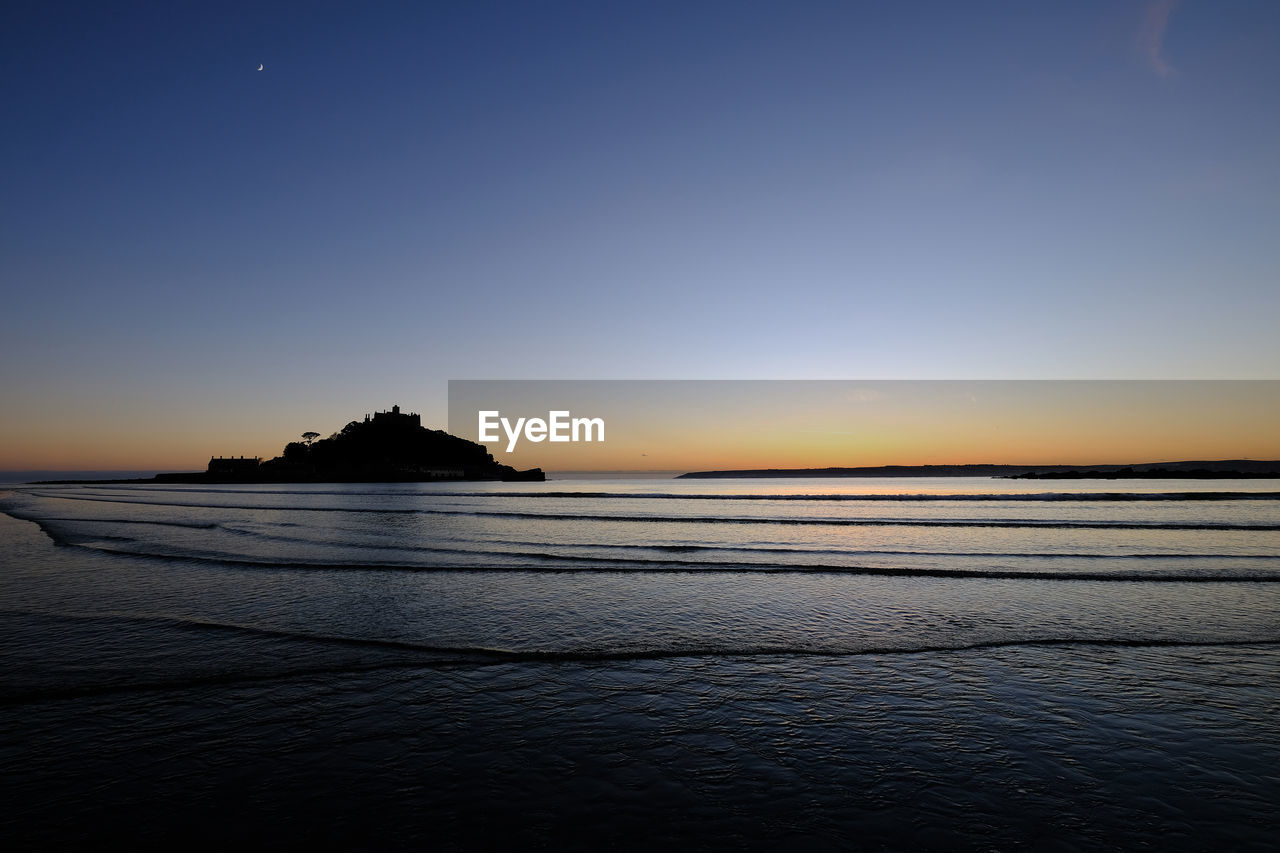 View of beach at sunset