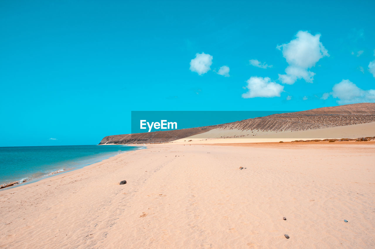 SCENIC VIEW OF SEA AGAINST BLUE SKY