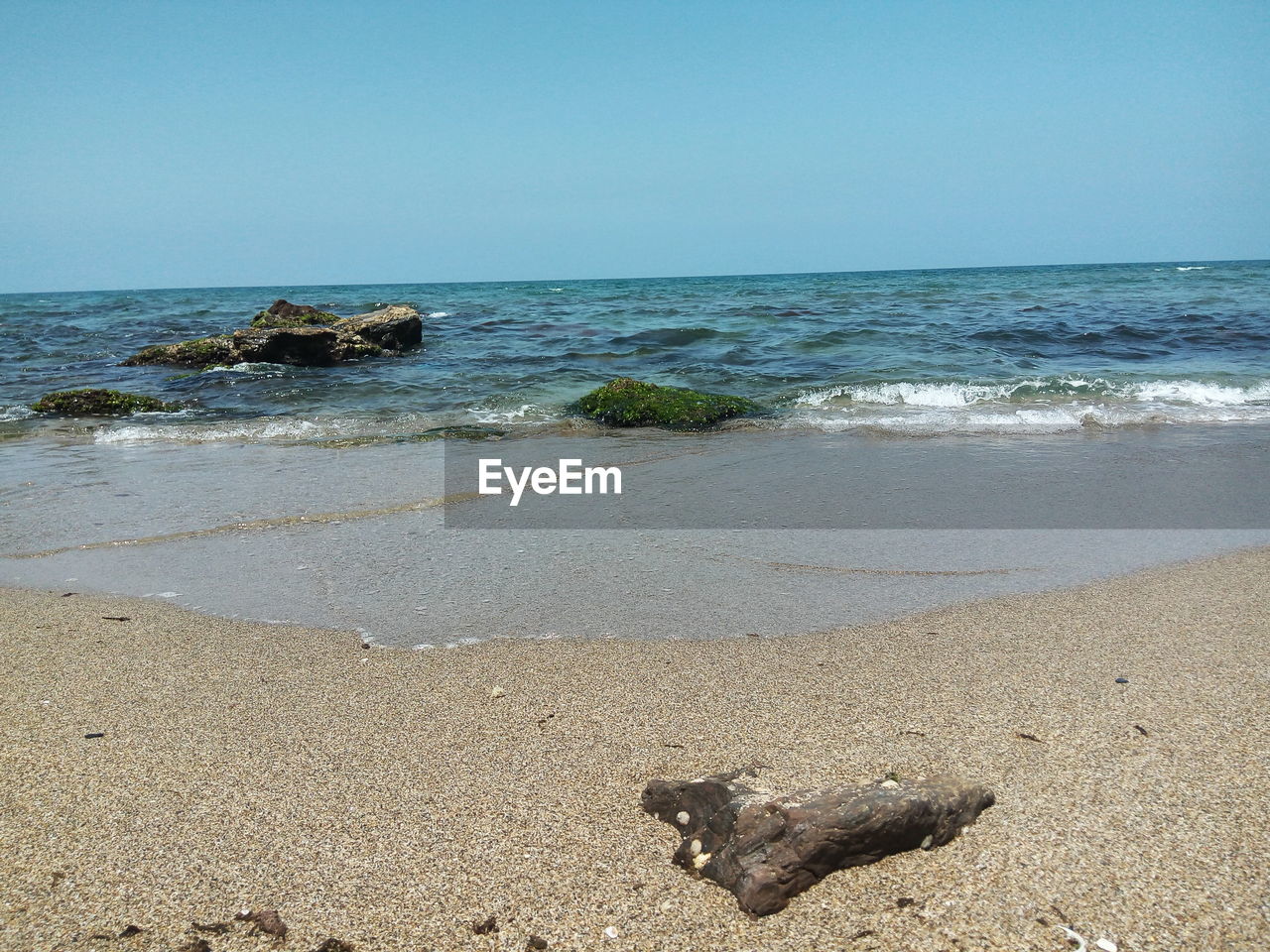 Scenic view of sea against clear sky