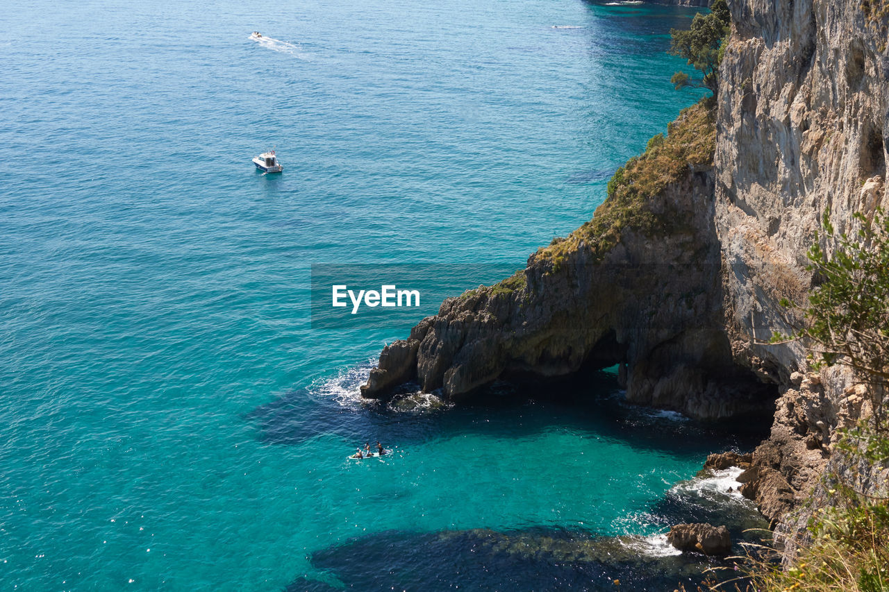 High angle view of rock formation in sea