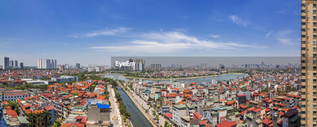 High angle view of city buildings against sky