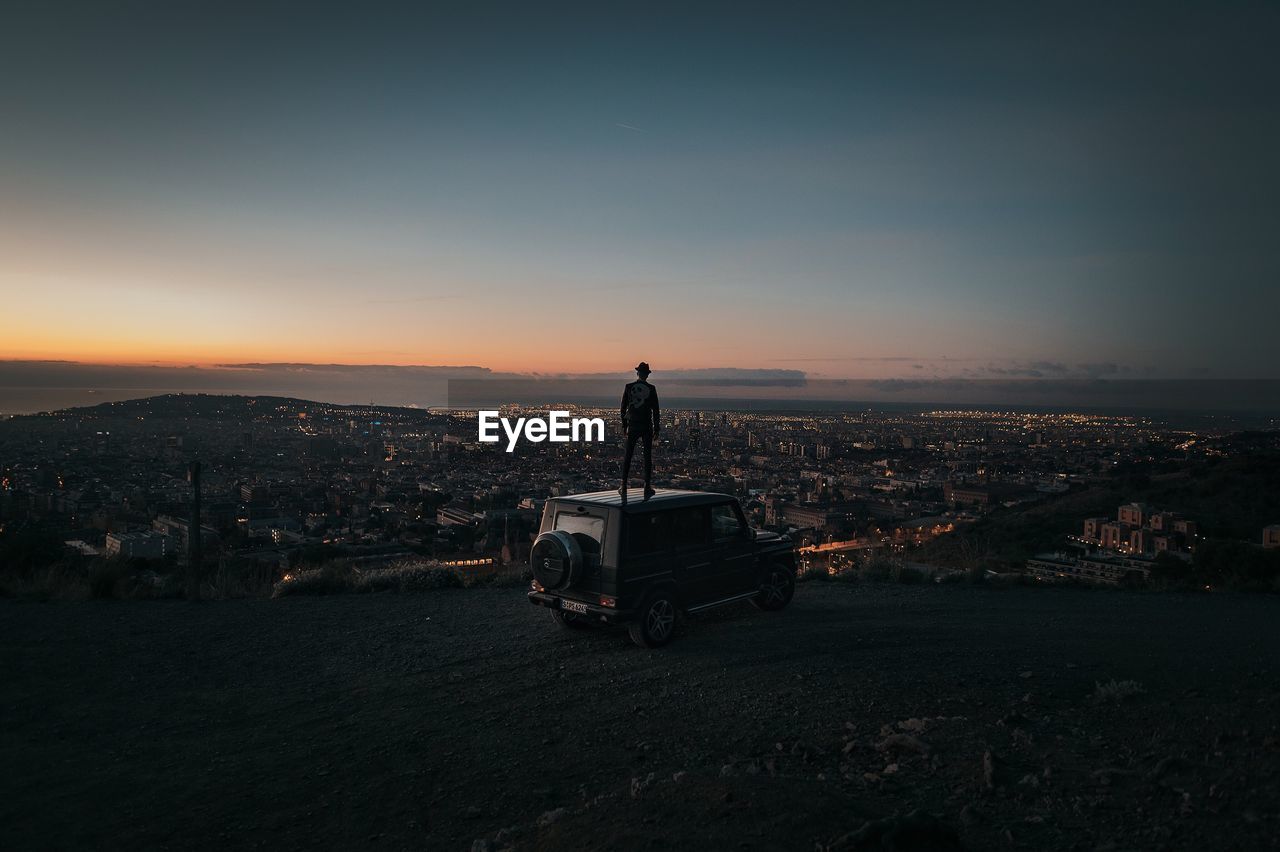 VIEW OF CITYSCAPE AGAINST SKY DURING SUNSET