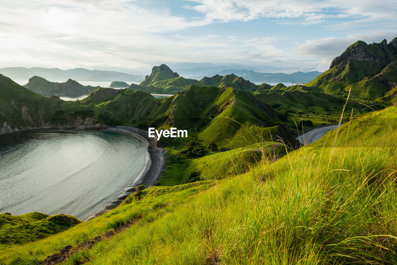 View of green-capped mountains of padar island