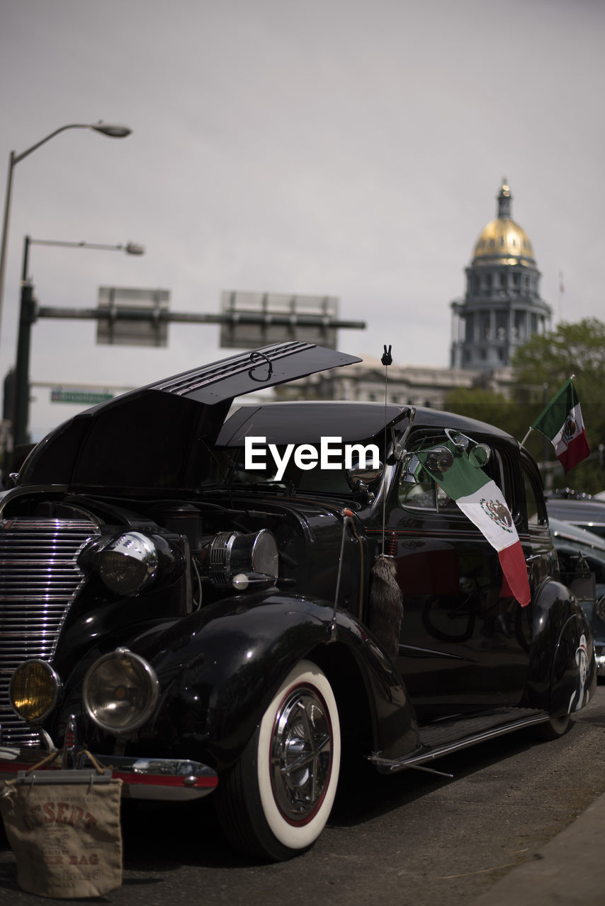 VINTAGE CAR ON CITY STREET