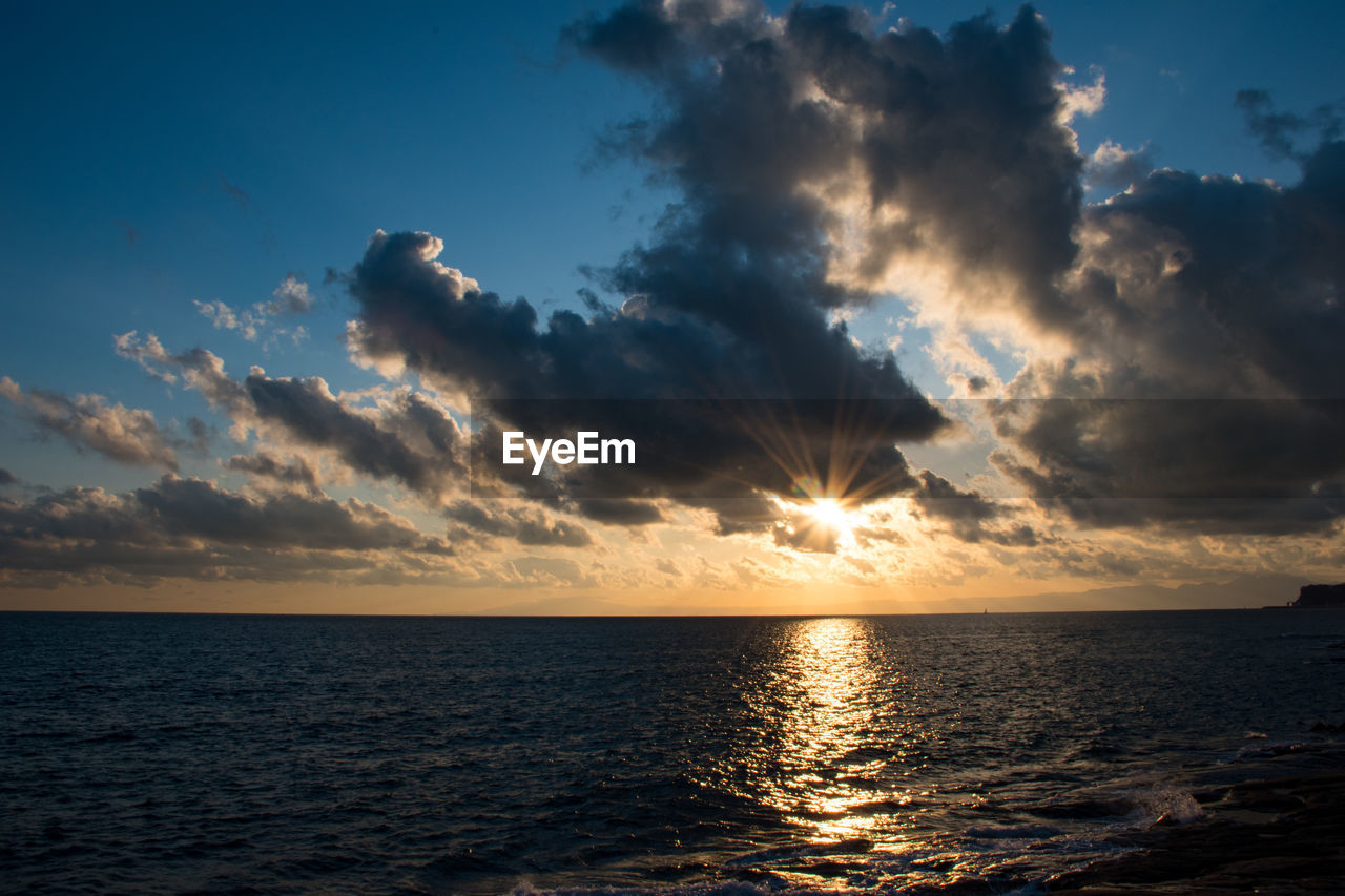 Scenic view of sea against sky during sunset