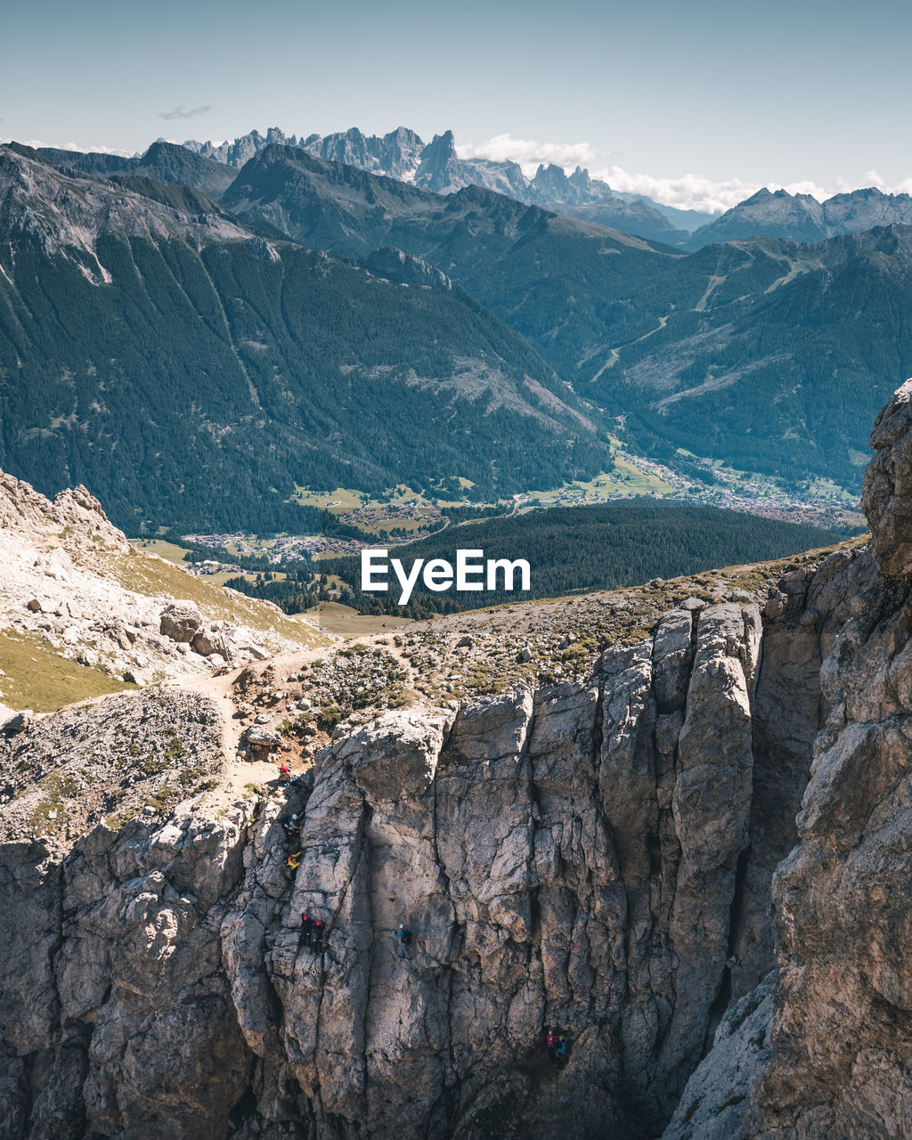 Aerial view of land and mountains against sky