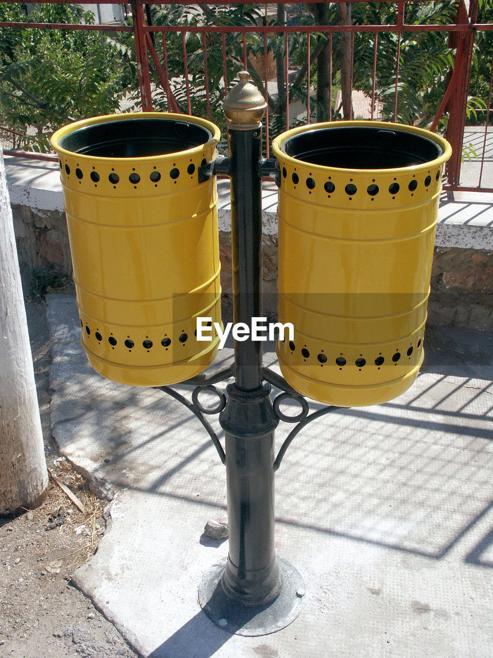 Dimos Anogeon Waste Bin 1 Travel Photography 'Dimos Anogeion' Rubbish Bin Tourism Cleanliness Historic WWII Centre No People Outdoors Photography Sunlight Day Close-up Shot Mustard/Black Colour - Location Anogia - Heraklion Crete Greece