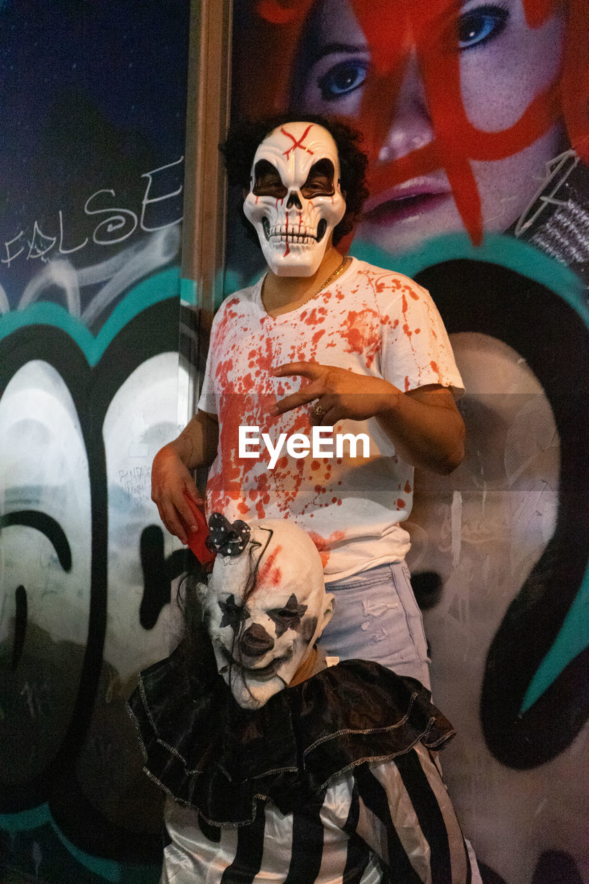 art, creativity, paint, one person, comics, human skeleton, graffiti, painting, bone, adult, street art, disguise, men, clothing, representation, mask, arts culture and entertainment, mask - disguise, celebration, human skull, human representation