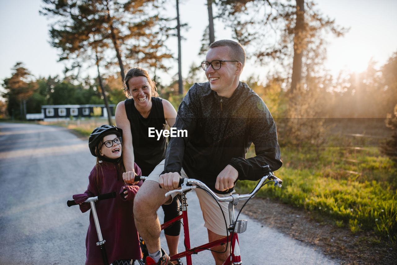 Parents with daughter cycling