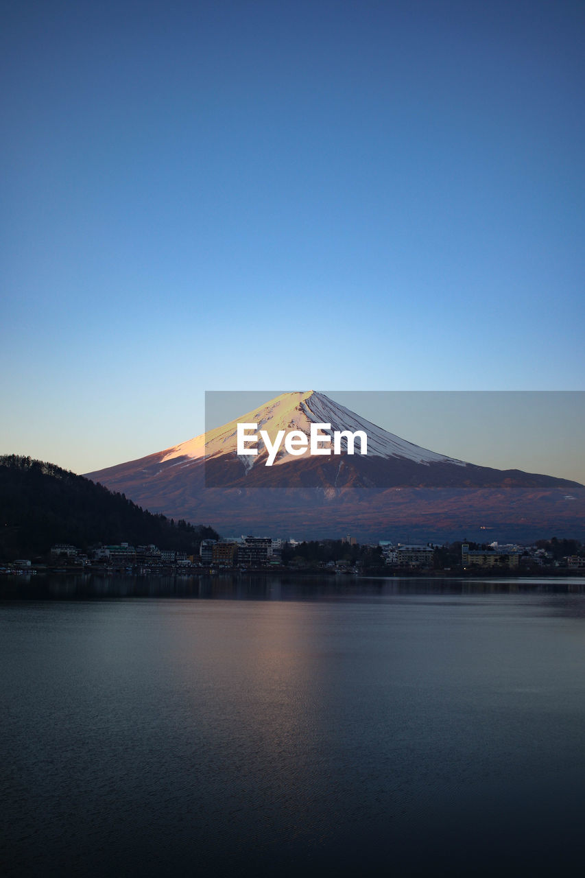 SCENIC VIEW OF SNOWCAPPED MOUNTAINS AGAINST CLEAR SKY