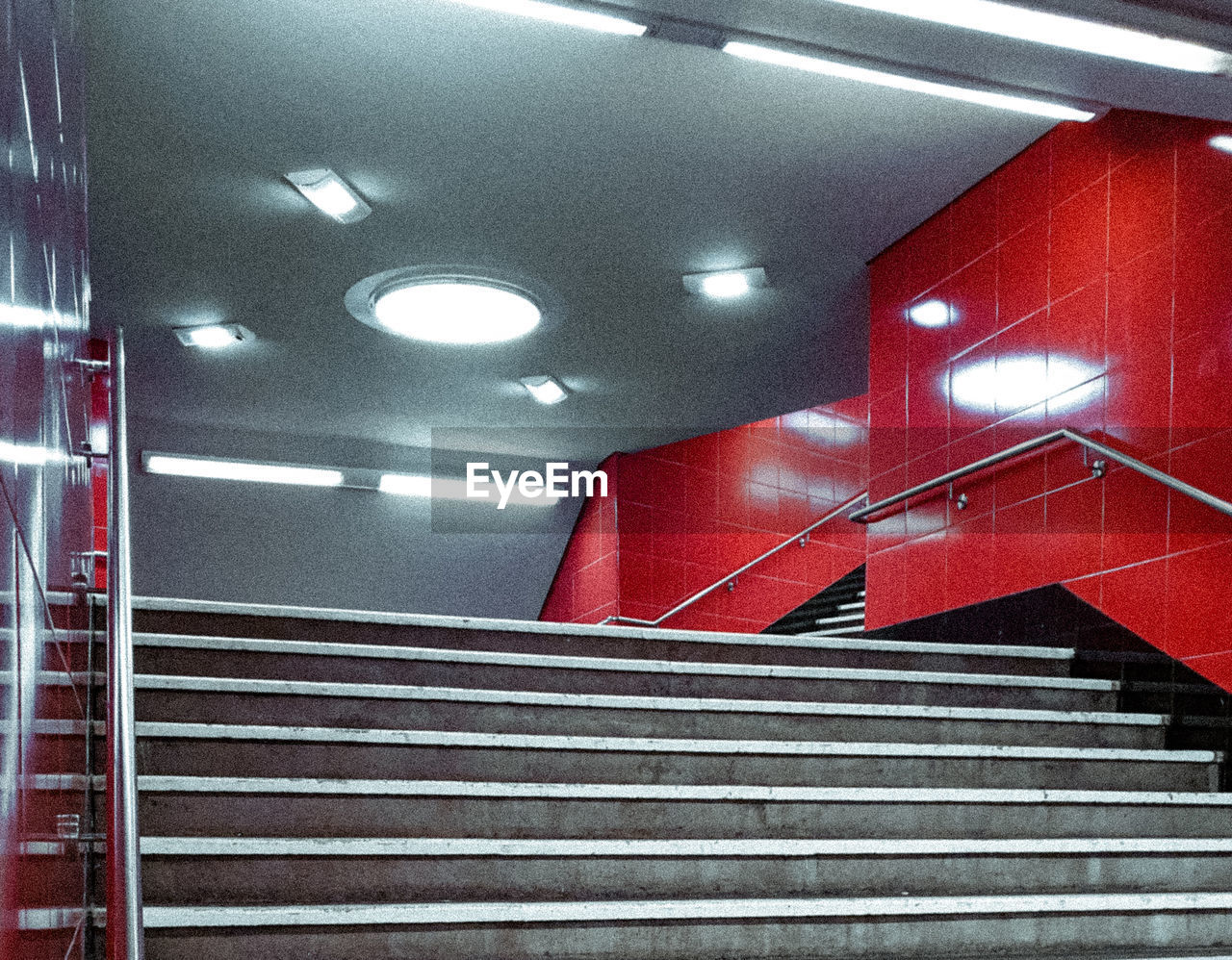 LOW ANGLE VIEW OF ILLUMINATED ESCALATOR