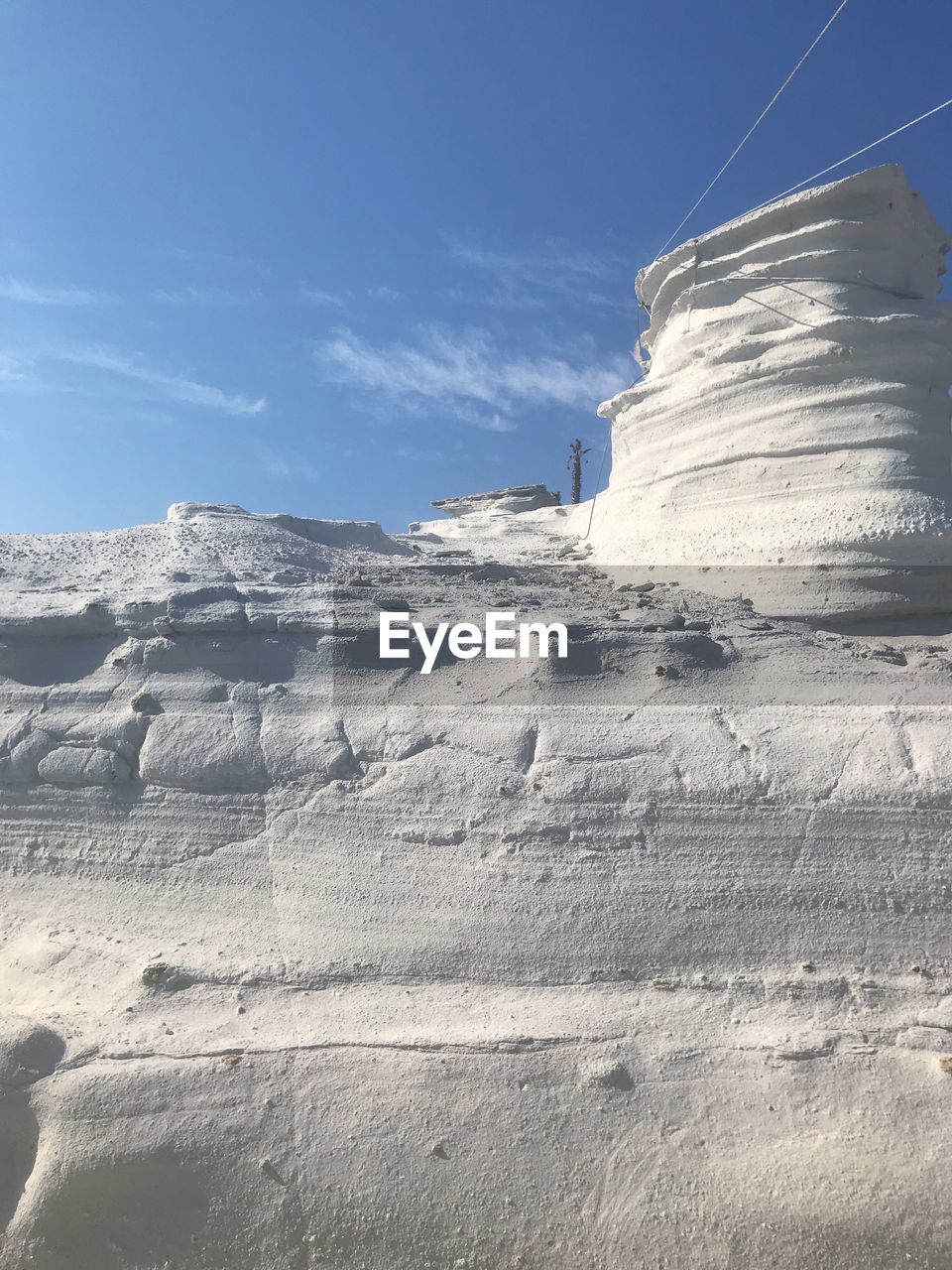 Low angle view of rock formation against sky