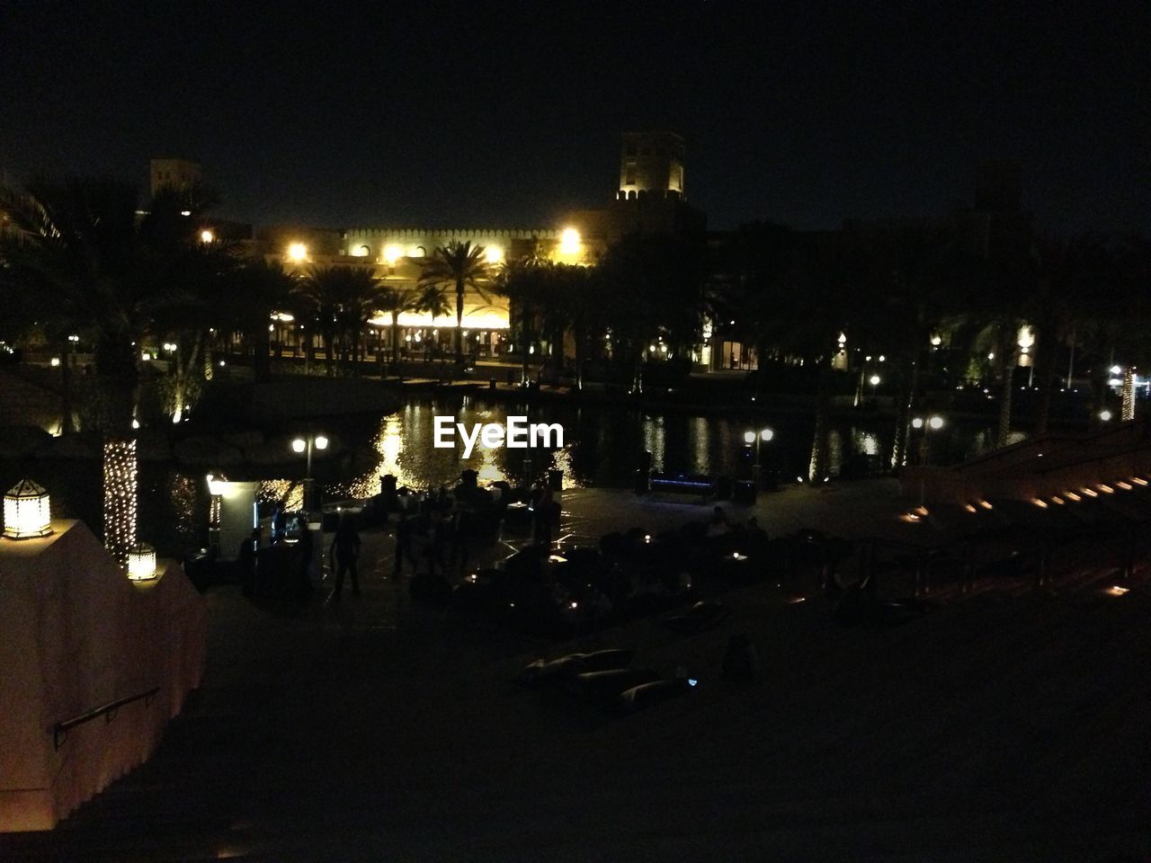 VIEW OF ILLUMINATED CITYSCAPE AT NIGHT