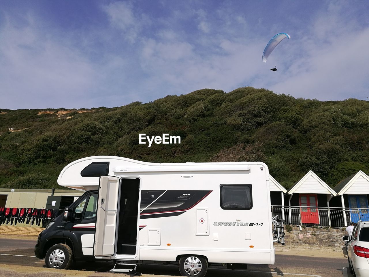 Cars on mountain against sky