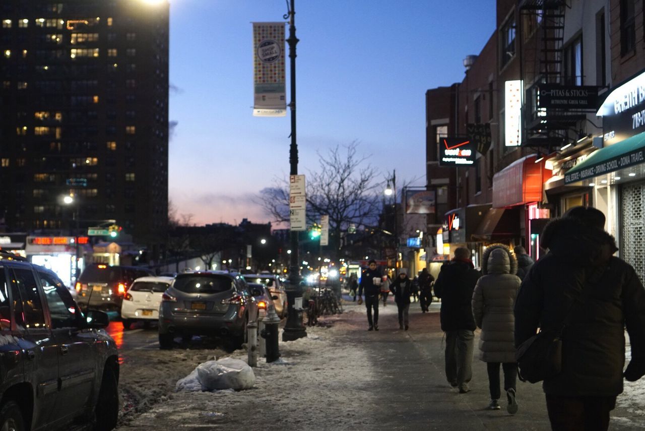 PEOPLE ON STREET IN CITY