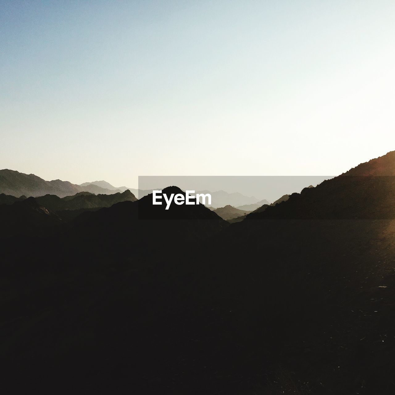 Scenic view of silhouette mountains against sky