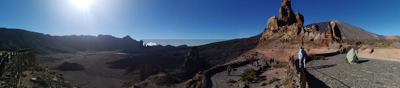 Panoramic view of mountains against clear sky