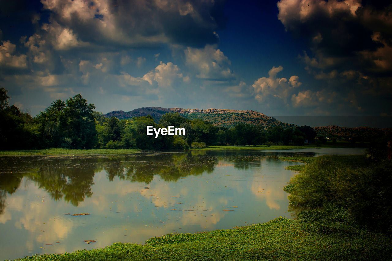 SCENIC VIEW OF LAKE WITH REFLECTION AGAINST SKY