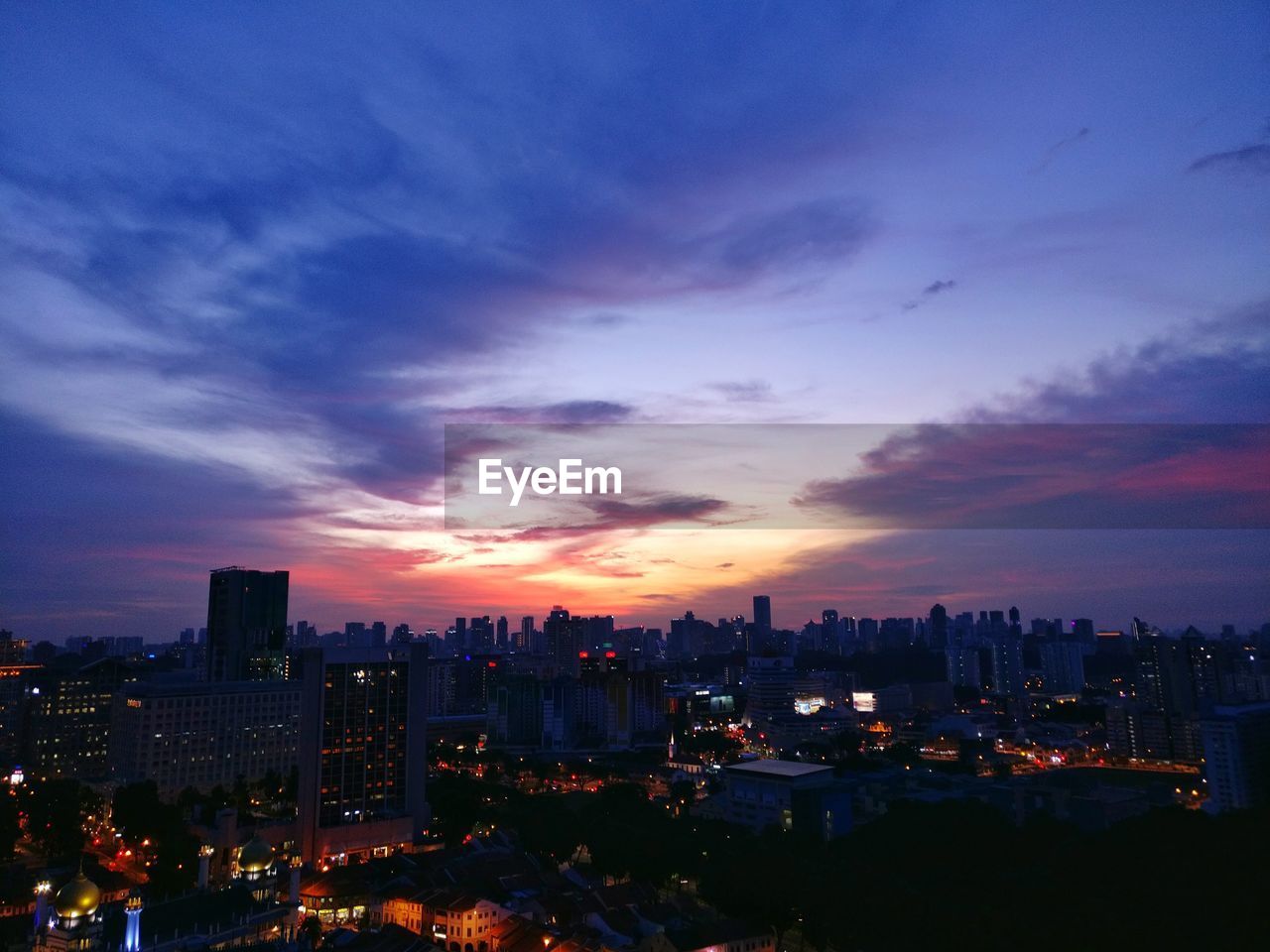 High angle view of city at sunset