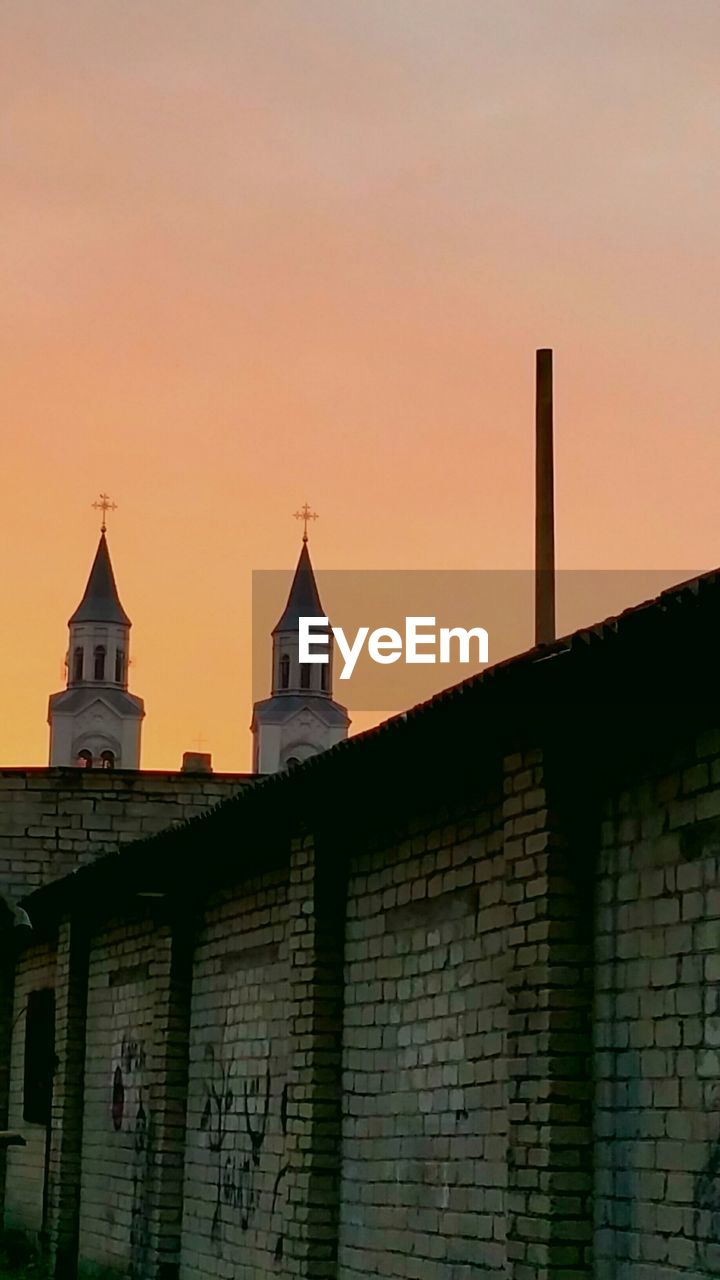 Low angle view of church against sky during sunset