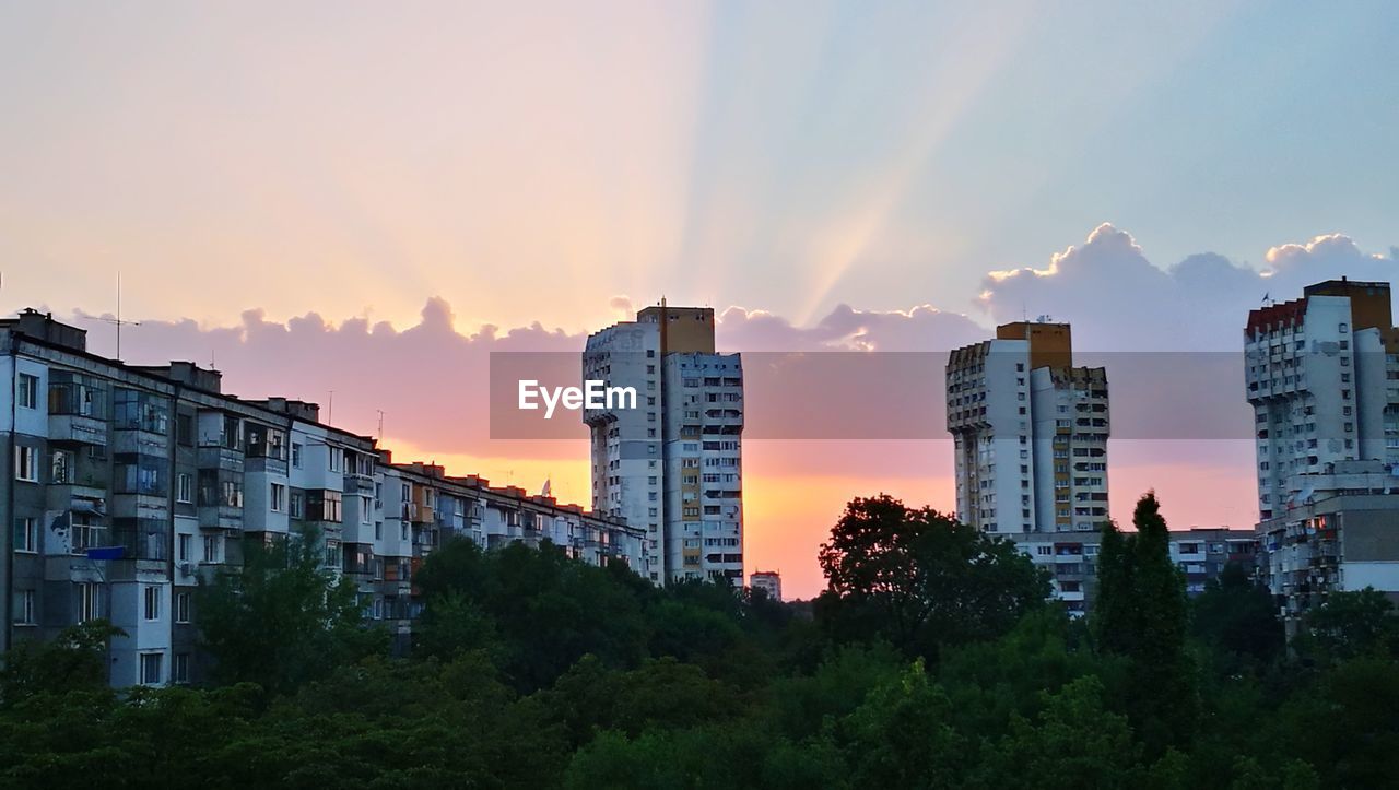 Panoramic view of city against sky during sunset