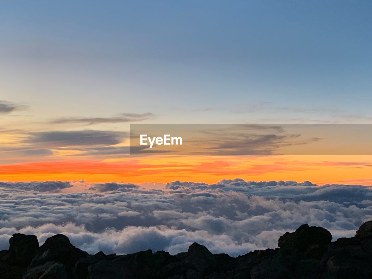 Scenic view of silhouette mountains against sky during sunset