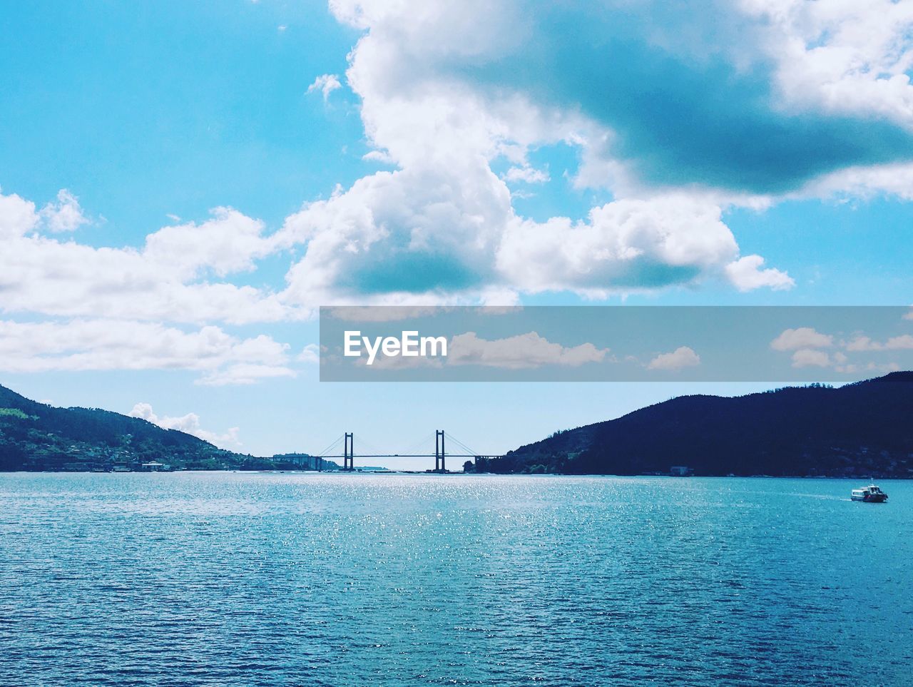 Scenic view of sea against cloudy sky