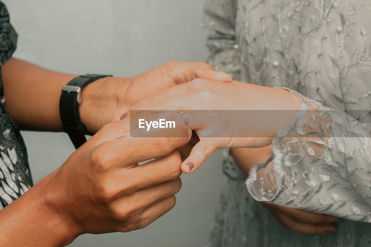 Cropped hand of man washing hands