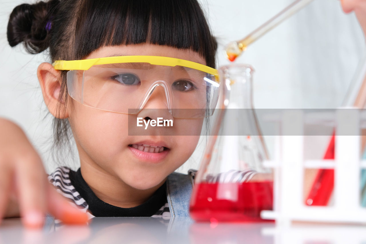 Close-up of girl experimenting in lab