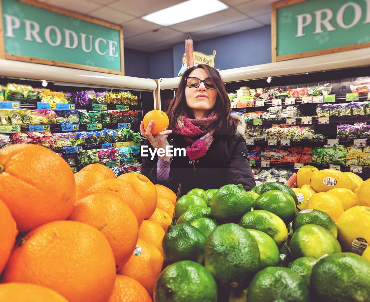 WOMAN STANDING IN A MARKET