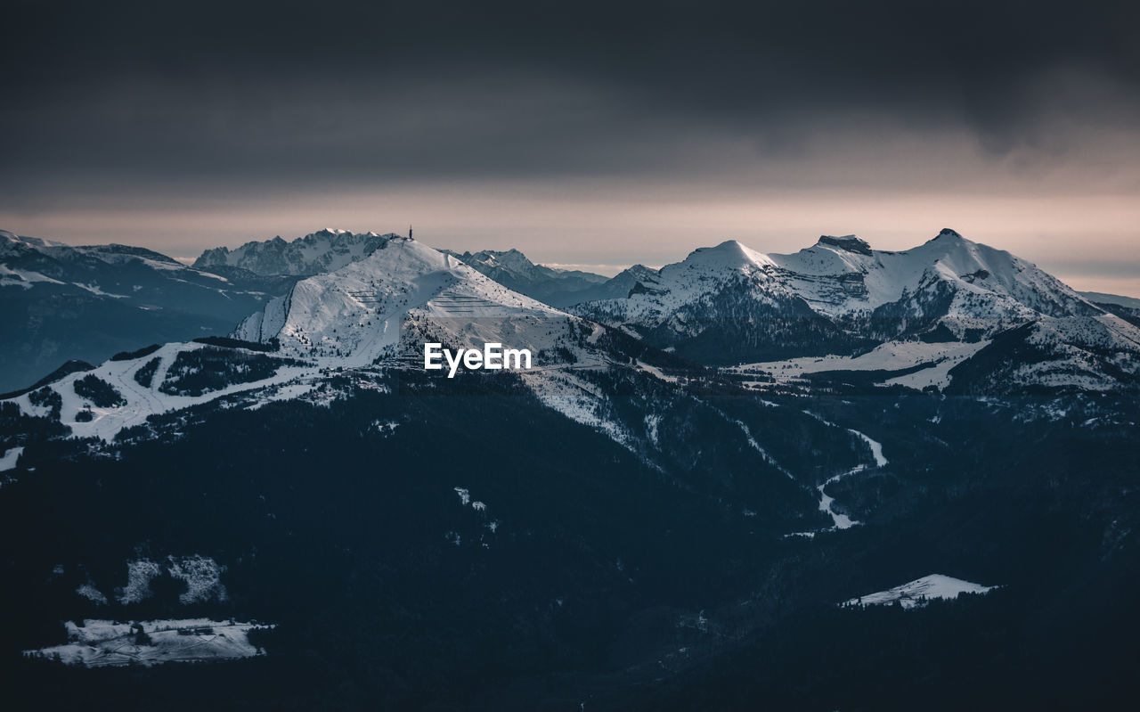 Scenic view of snowcapped mountains against sky