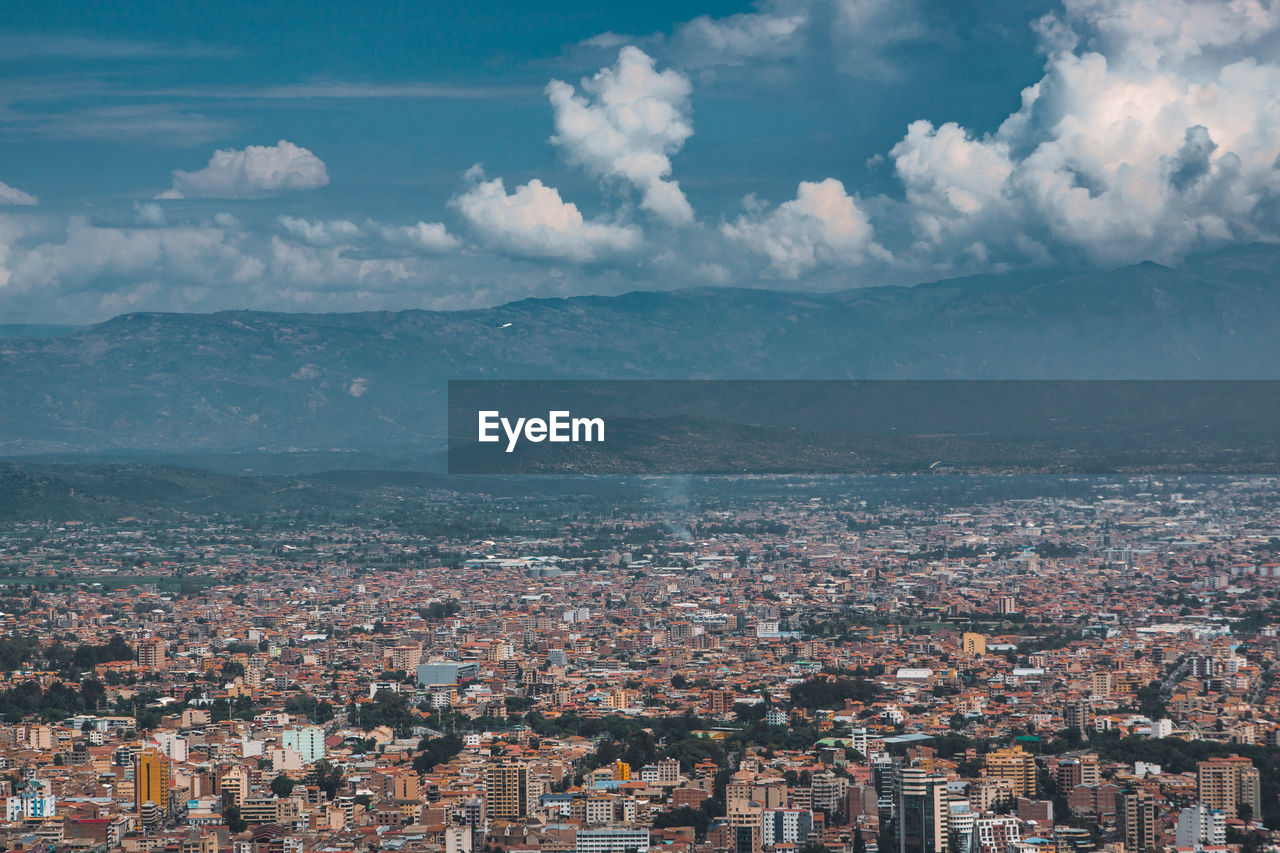 Aerial view of townscape against sky