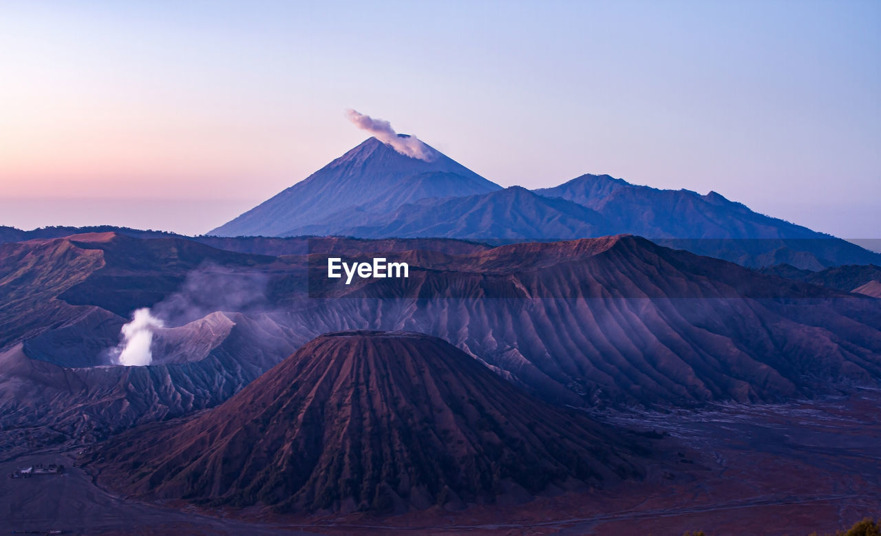 Mount bromo, in the tengger caldera, with semeru volcano behind.