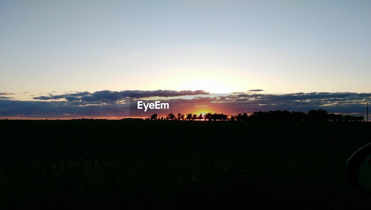 Scenic view of landscape at sunset