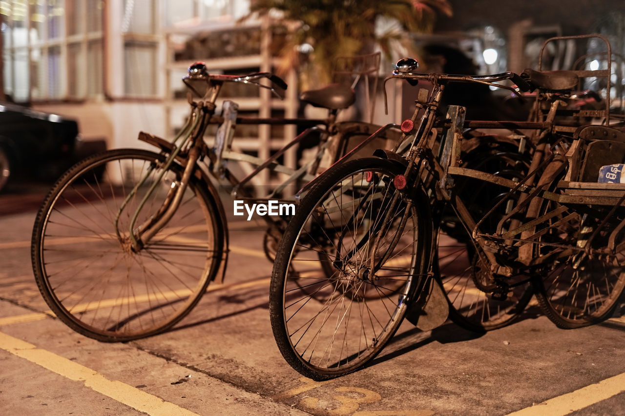 Bicycles parked on footpath in parking lot