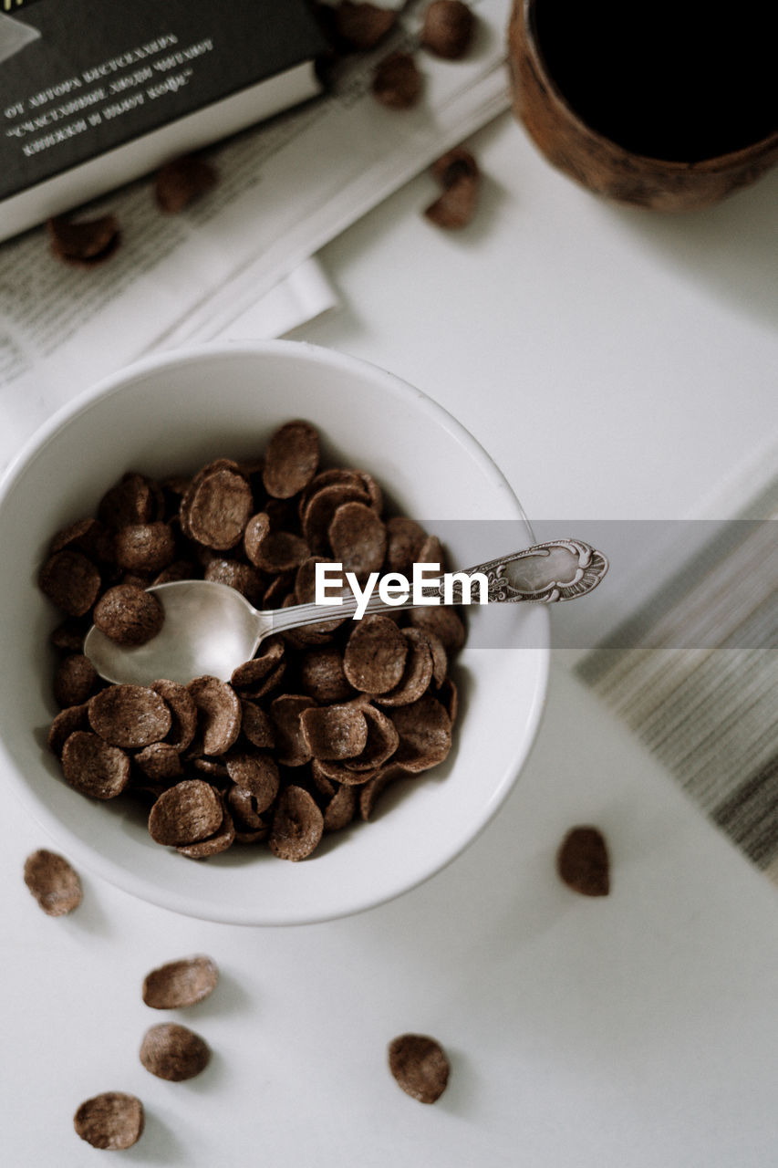 HIGH ANGLE VIEW OF COFFEE BEANS IN GLASS