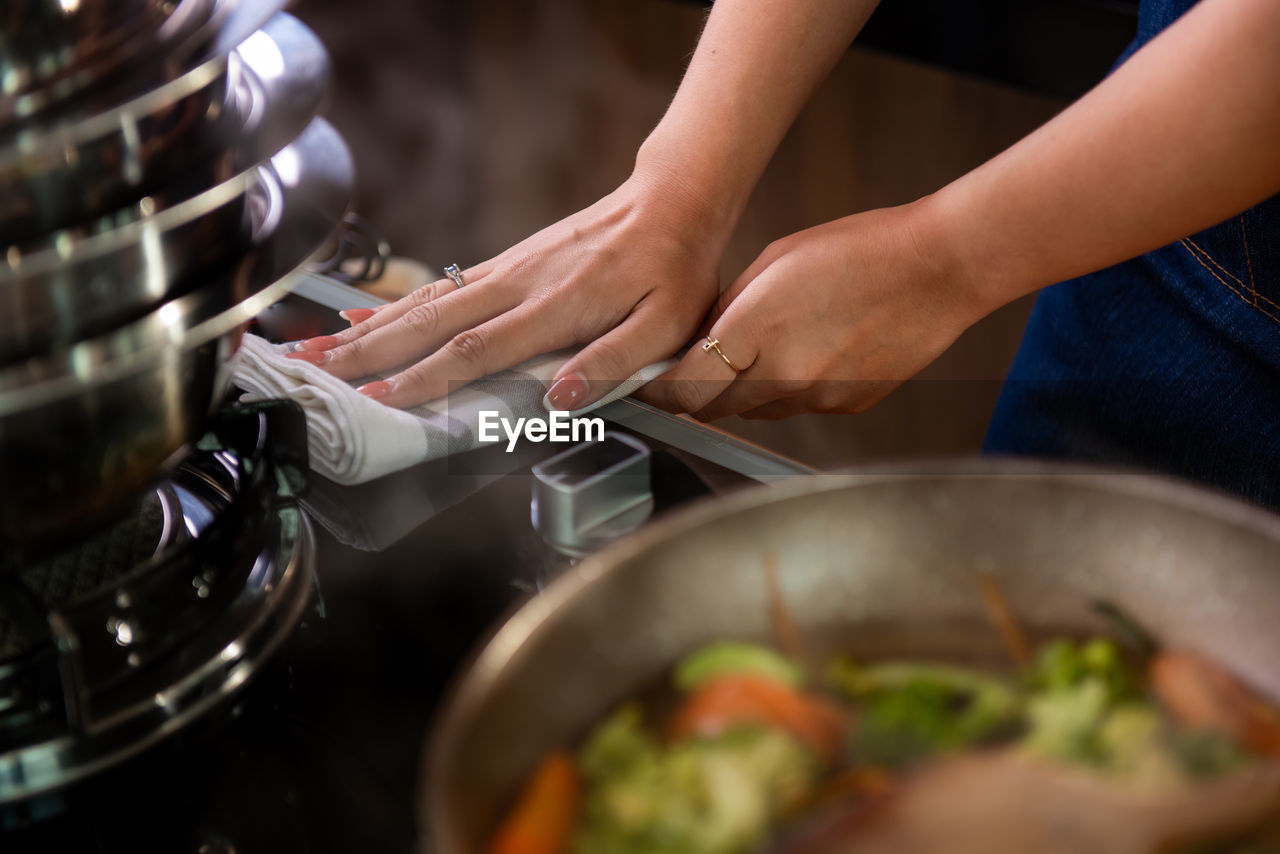 midsection of woman preparing food