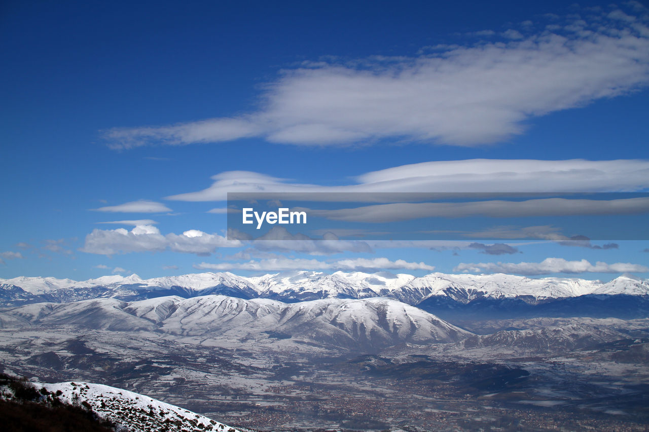 SCENIC VIEW OF SNOWCAPPED MOUNTAINS AGAINST SKY DURING WINTER