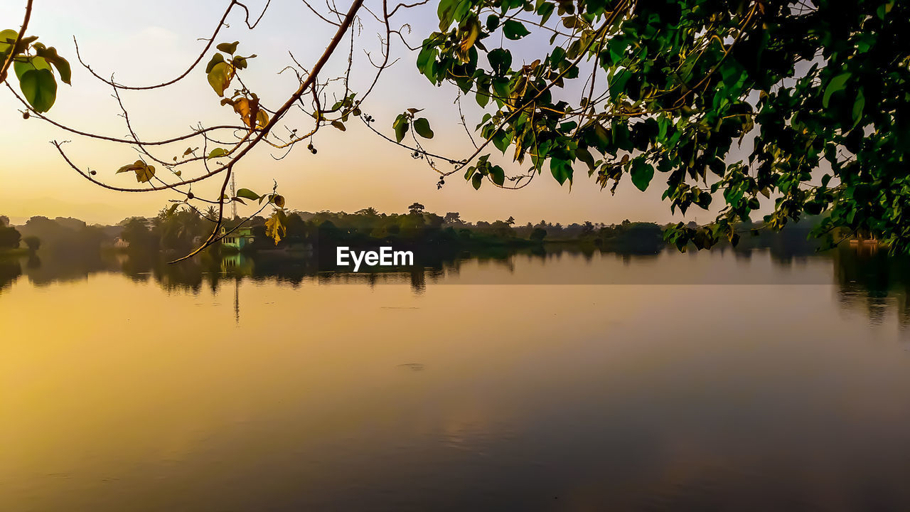 SCENIC VIEW OF LAKE DURING SUNSET