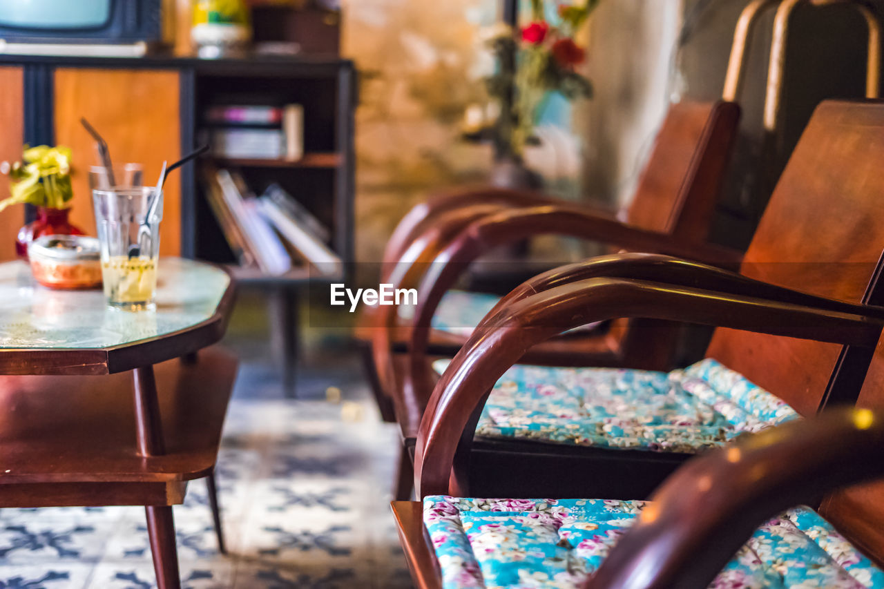 Empty chairs and tables in restaurant