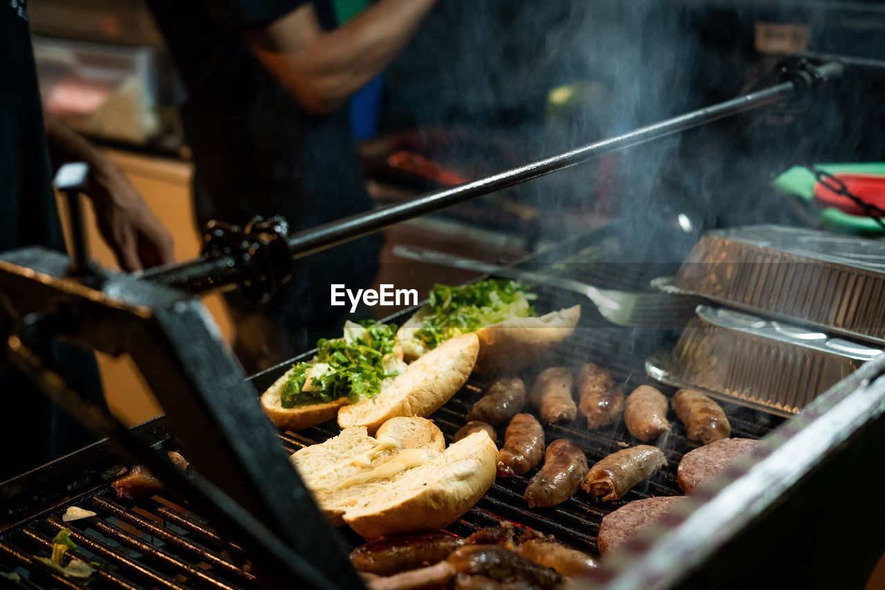 High angle view of meat on barbecue grill