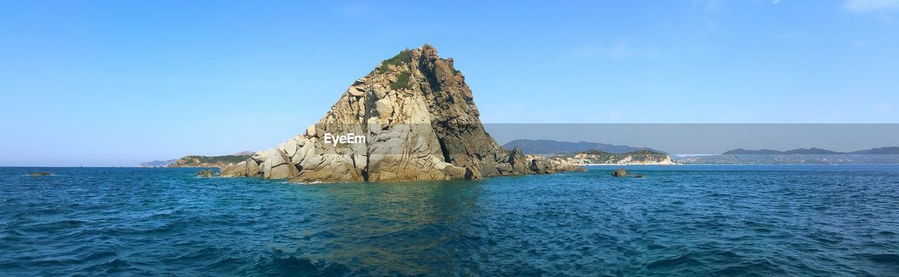 Scenic view of sea against blue sky